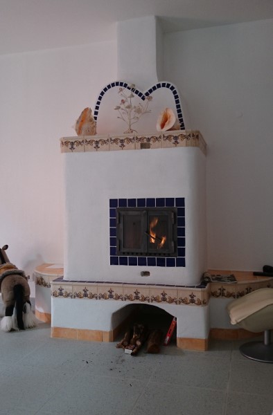 This fireplace was made with plaster and tiles.
