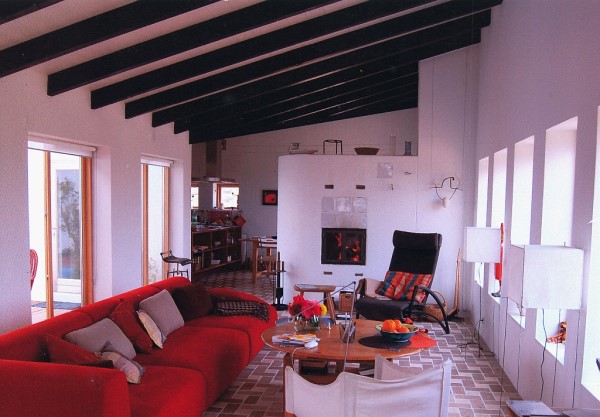 This beautiful plastered fireplace is part of the kitchen and the living room